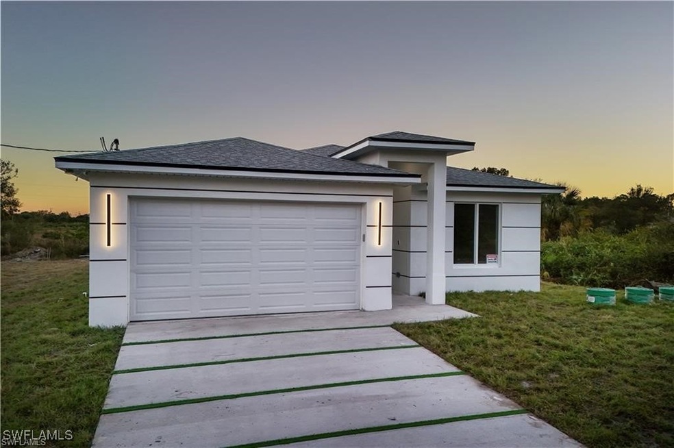 View of front of house featuring a garage and a la