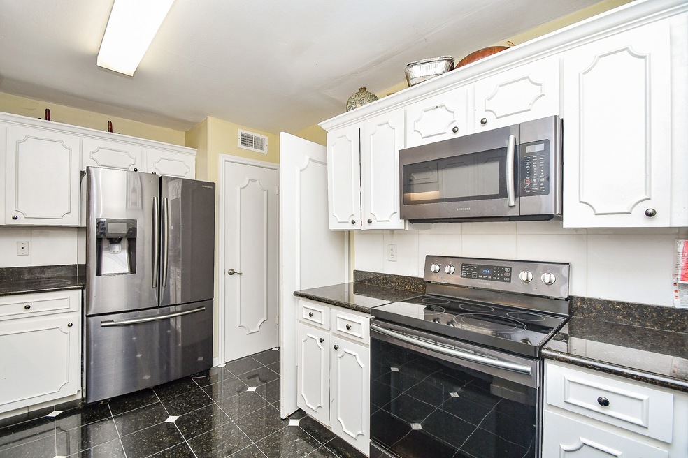 Beautifully updated Kitchen with Granite Counters and Stainless Steel Appliances!