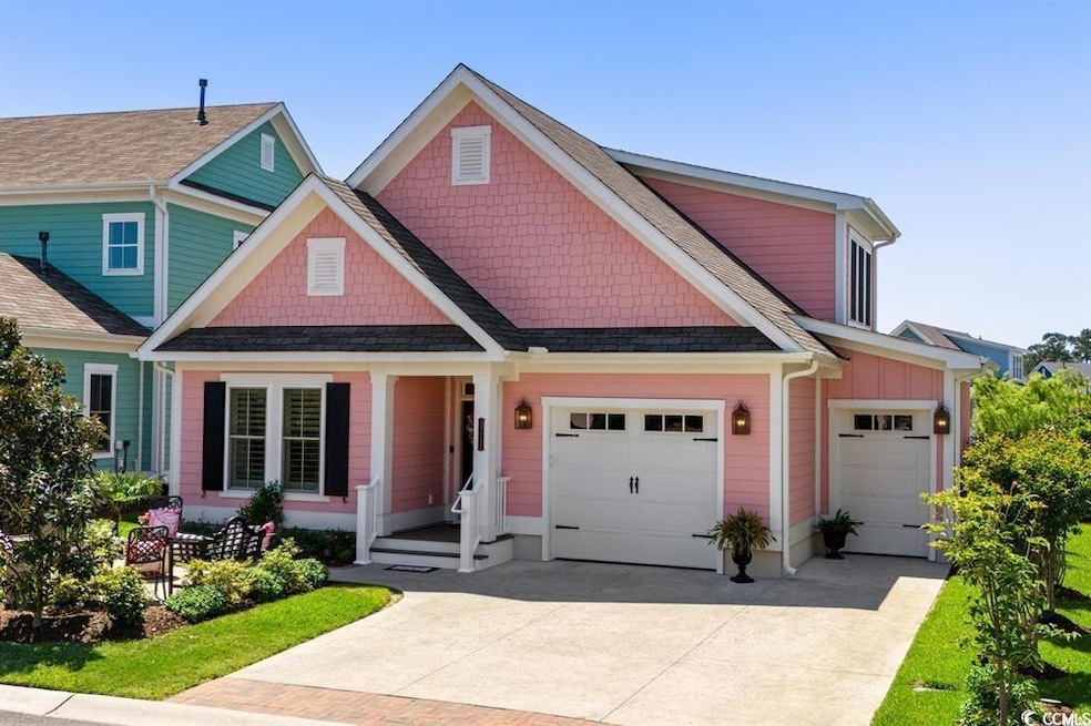 View of front of property featuring a garage