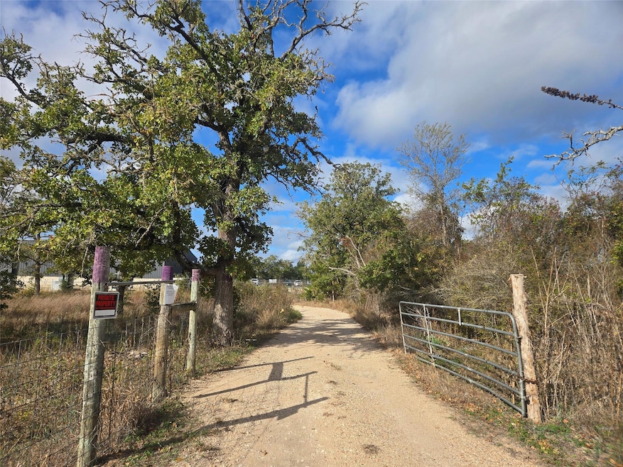 View of street featuring a gate and a gated entry