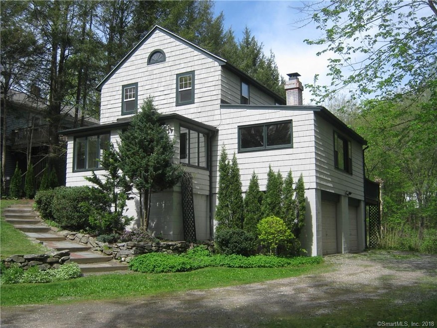 Front with 2 car basement garage and deck on rear.