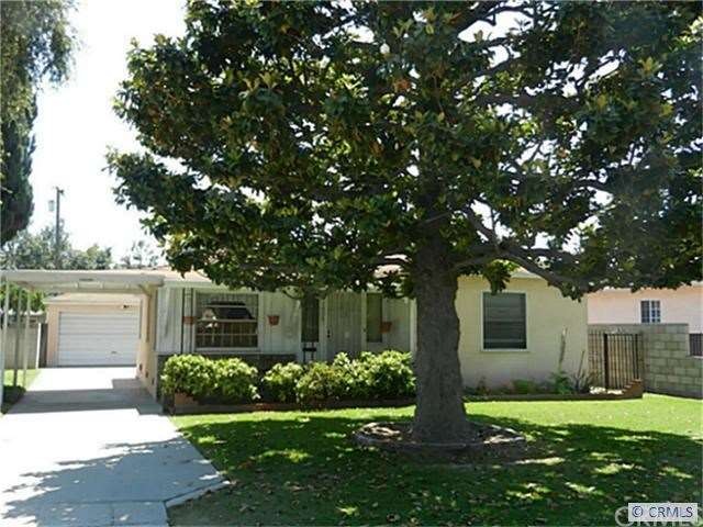 Front View with Magnificent Magnolia Tree to Shade