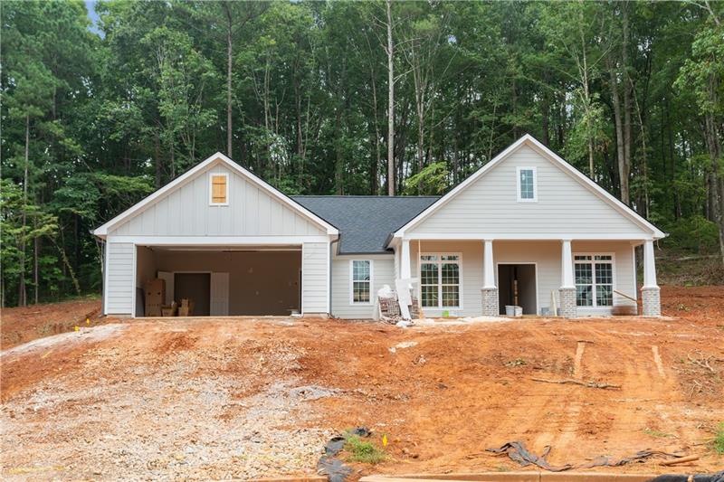 This new construction ranch is located on a large 