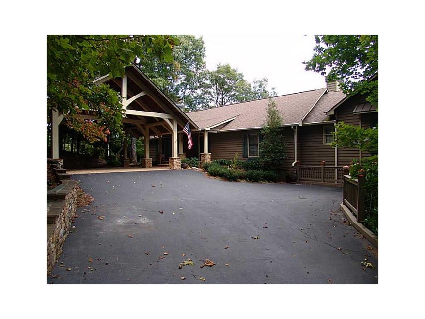 Exterior Front. Stone Wall Lined Driveway to overs