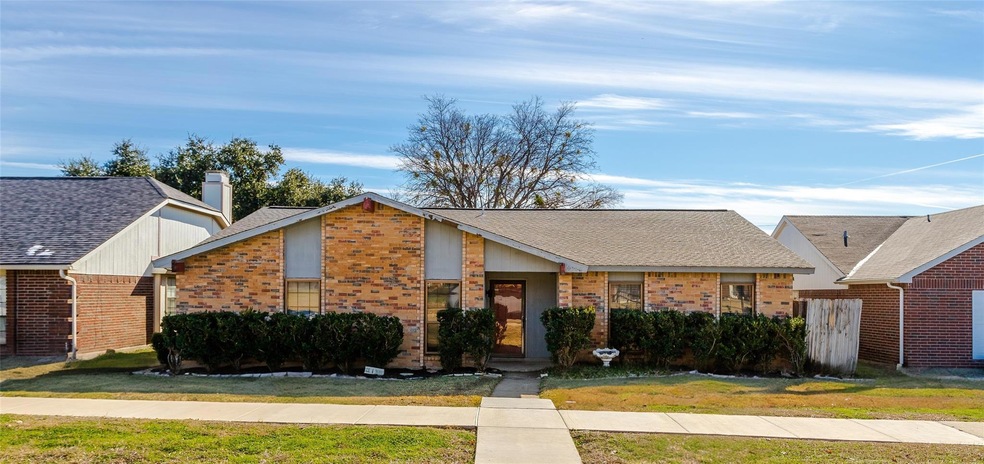 Single story home featuring a front yard