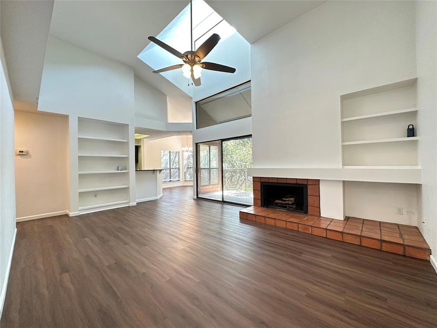 Unfurnished living room with a ceiling fan, high 