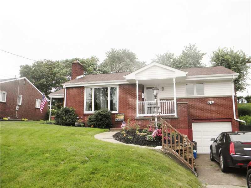 Exterior Front. Brick Ranch with a integral garage