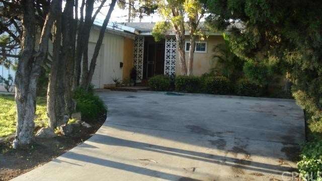 Lovely Cypress tree lined curved entry to double c