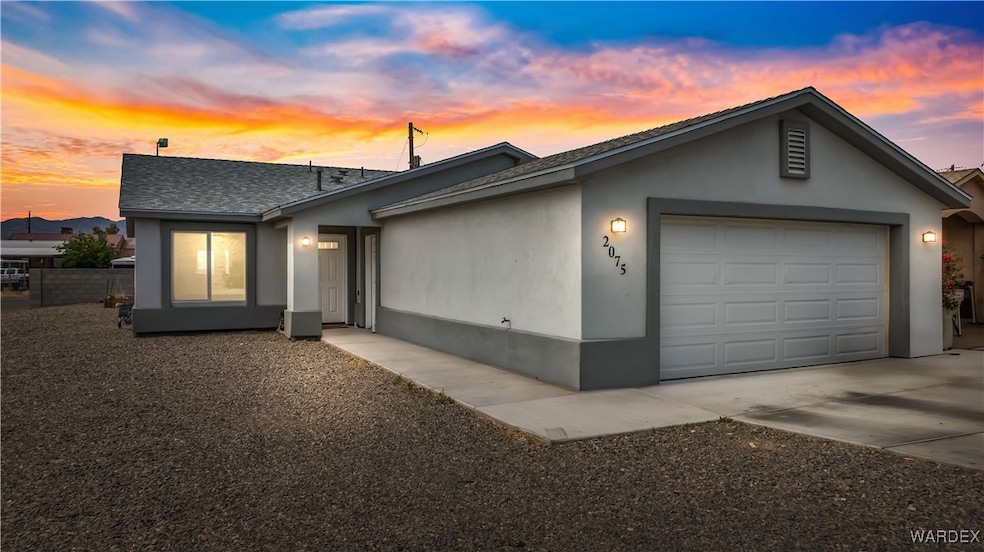View of front of property featuring concrete drive