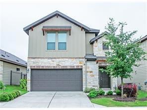 View of front of property featuring stone siding,
