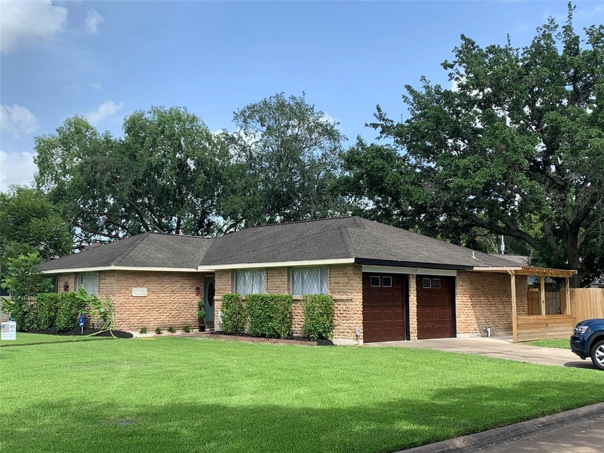 Side view of home on corner lot with nice size front yard