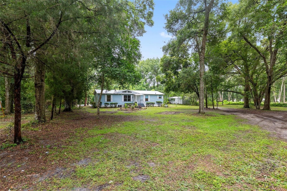 2 acre compound with 3 homes and 4 accessory structures
