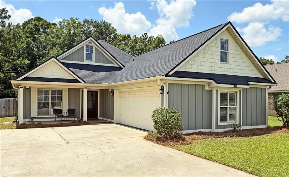 View of front of home featuring a garage, board and batten siding, a porch, roof with shingles, and concrete driveway