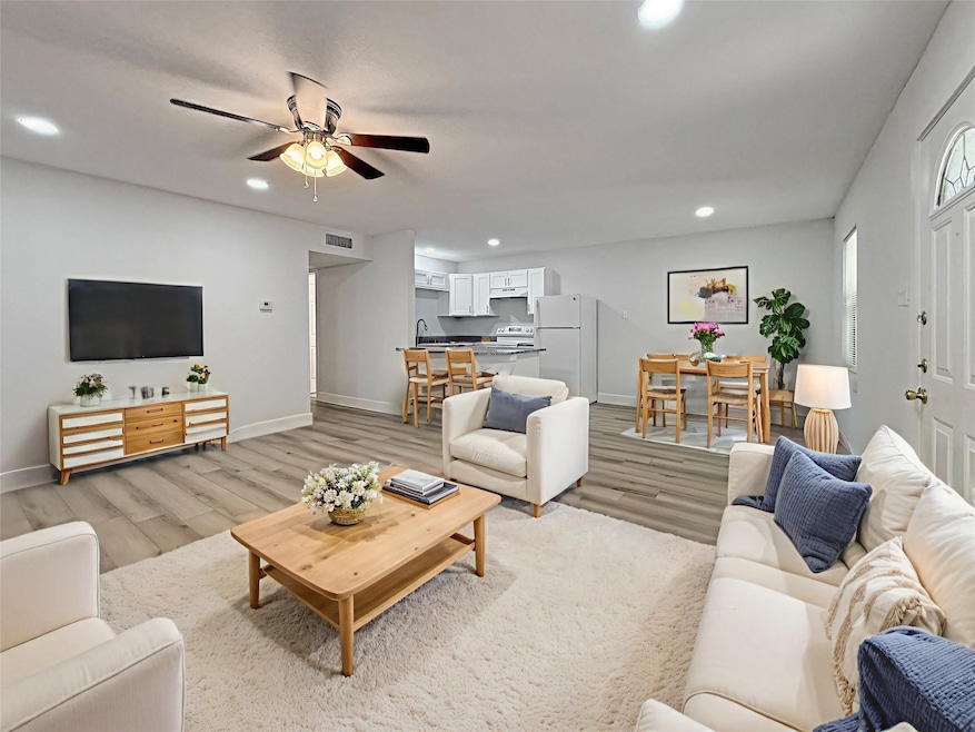 Experience the inviting charm of this virtually staged great room, seamlessly blending modern elegance with cozy comfort, perfect for both relaxing and entertaining.