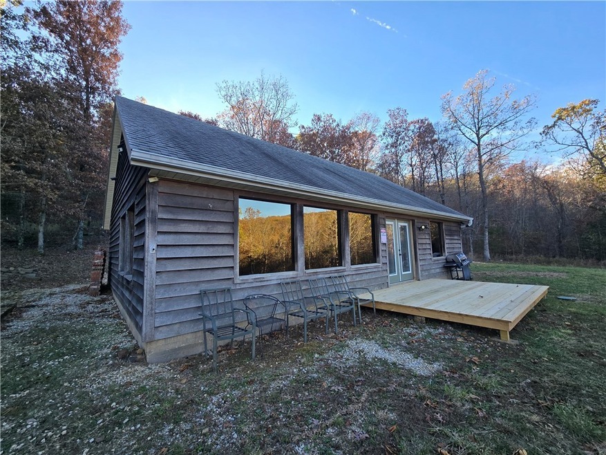 Front w/t deck. All of the wood siding is good. Th