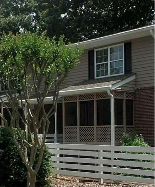Exterior Front. Two-story townhouse-style condo wi