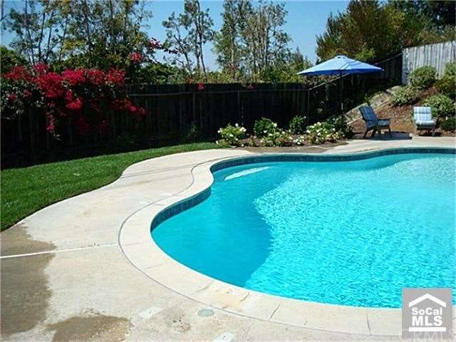 Updated pool in the large backyard with lots of en