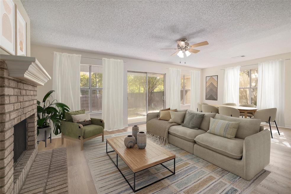 Living area with wood finished floors, a textured