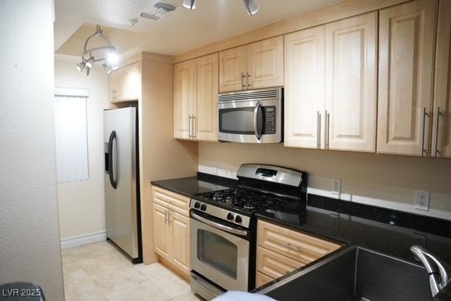 Kitchen with appliances with stainless steel finis