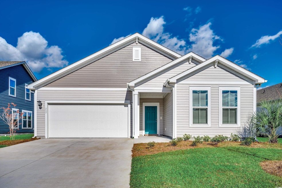 View of front of house featuring a garage, drivewa