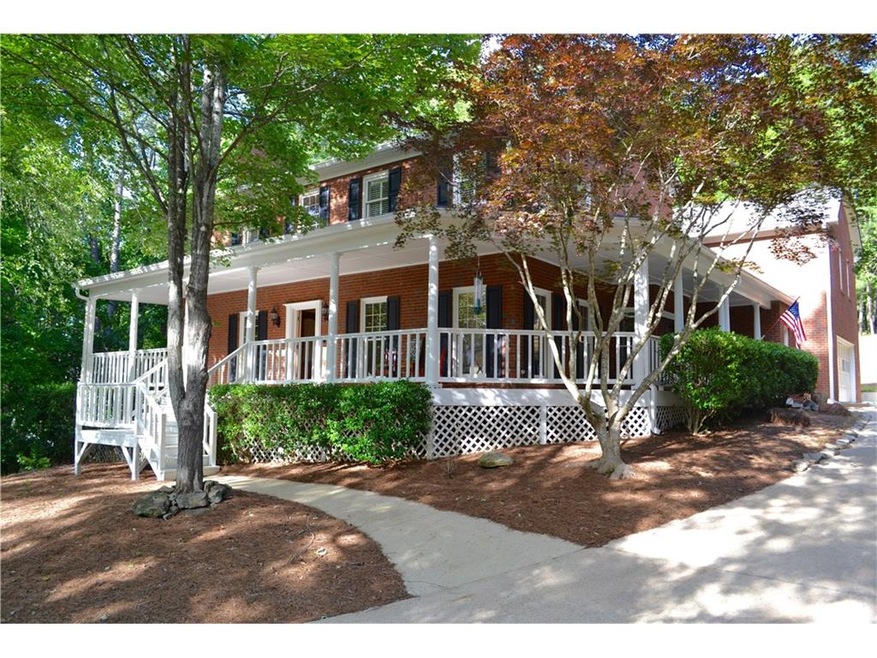 Beautiful 4 sided brick home with charming wrap ar