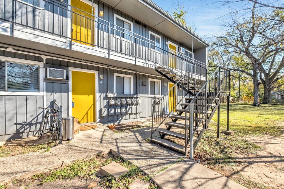 View of community with stairway and a lawn