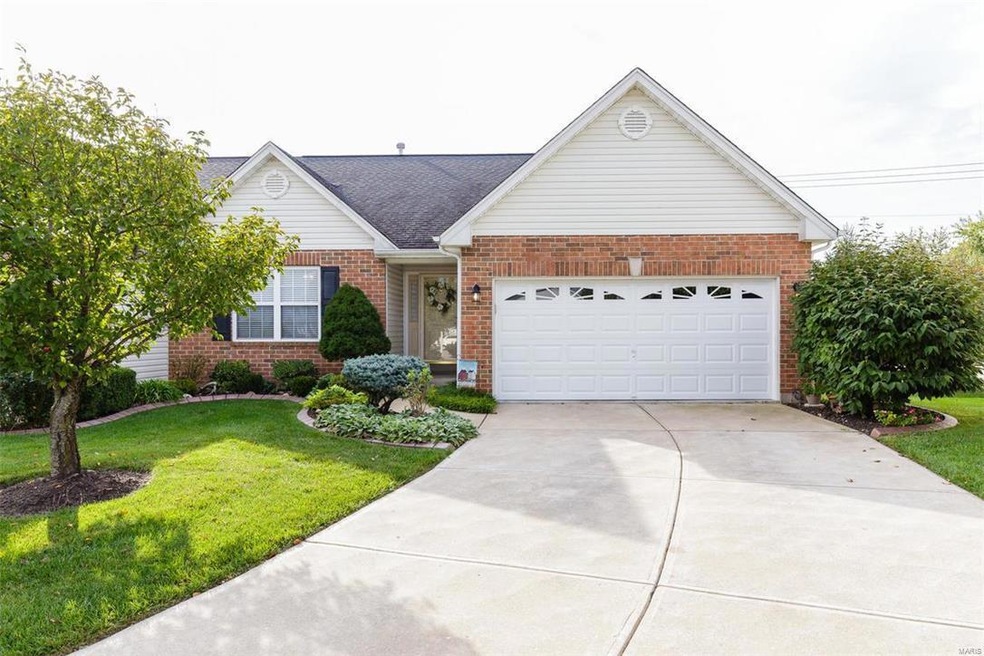Beautiful landscaping, large 2 car garage, and an 