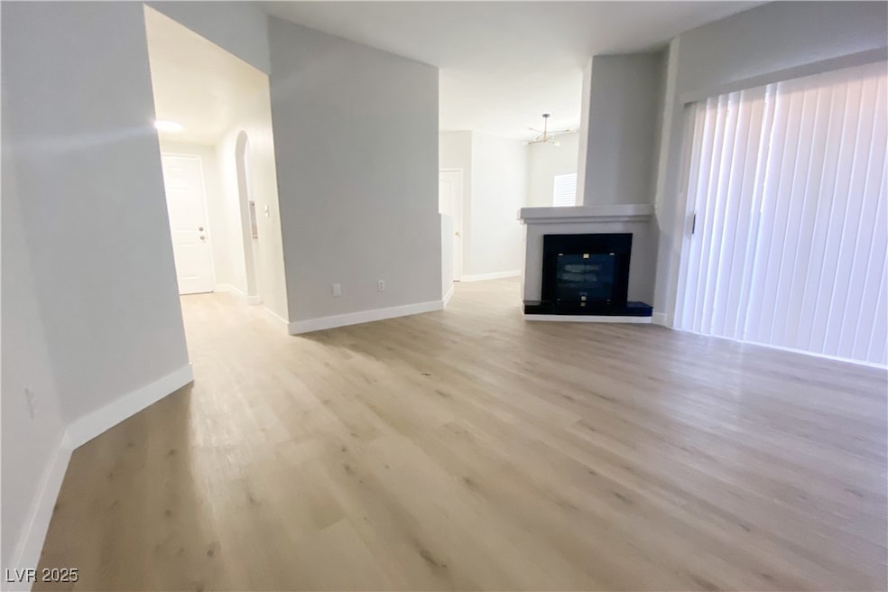 Unfurnished living room featuring light wood-style