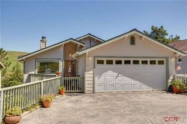 Inviting entry and two car garage with concrete st