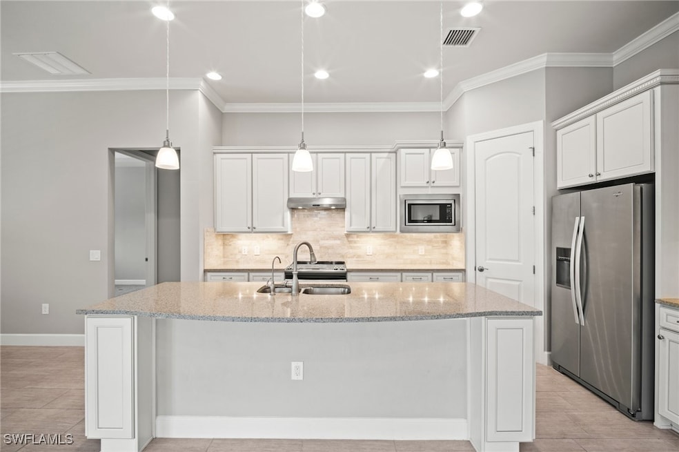Kitchen featuring appliances with stainless steel