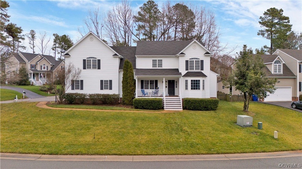 Front facade featuring a front yard and a porch