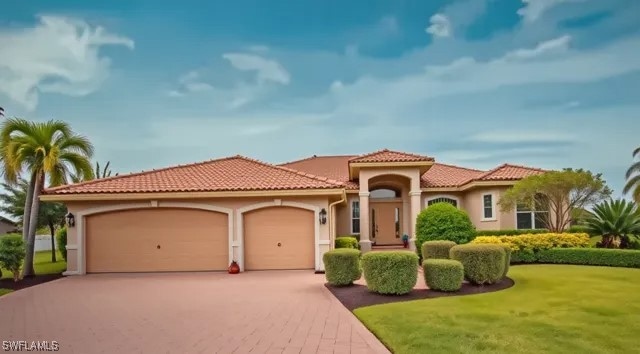 Mediterranean / spanish house featuring a front lawn, stucco siding, an attached garage, driveway, and a tile roof