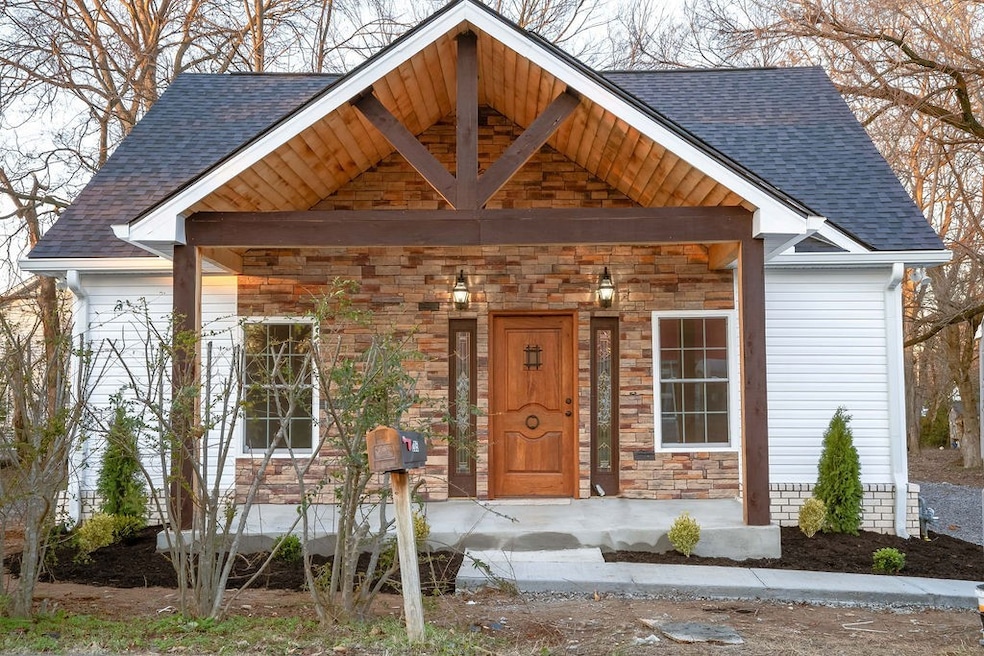 Beautiful beams and wooded covered porch adds character and make this home so inviting.