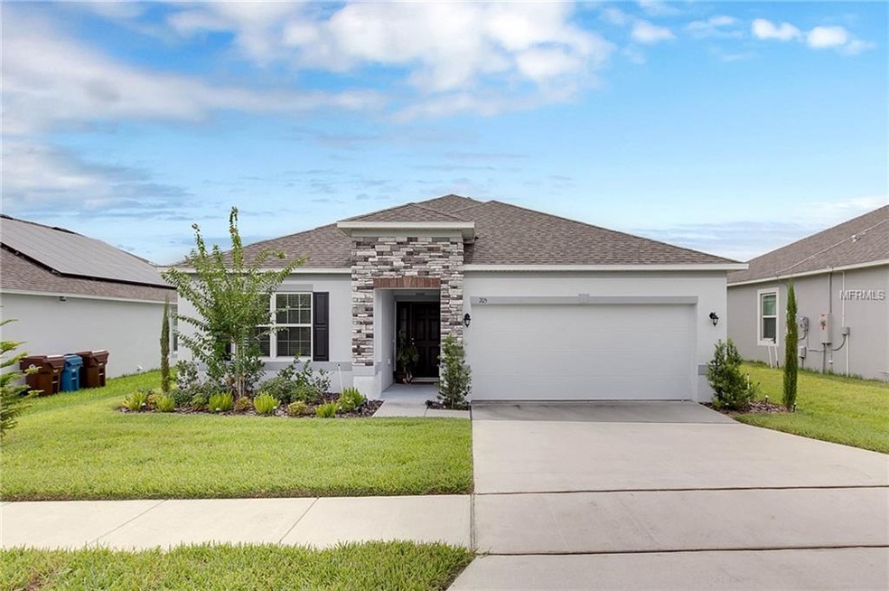 This quaint, bungalow features a wide driveway, an