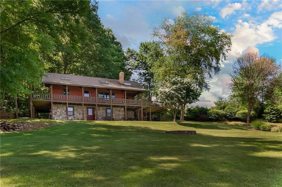This 3 bedroom 3 full bath Raised Log Home Is Tuck