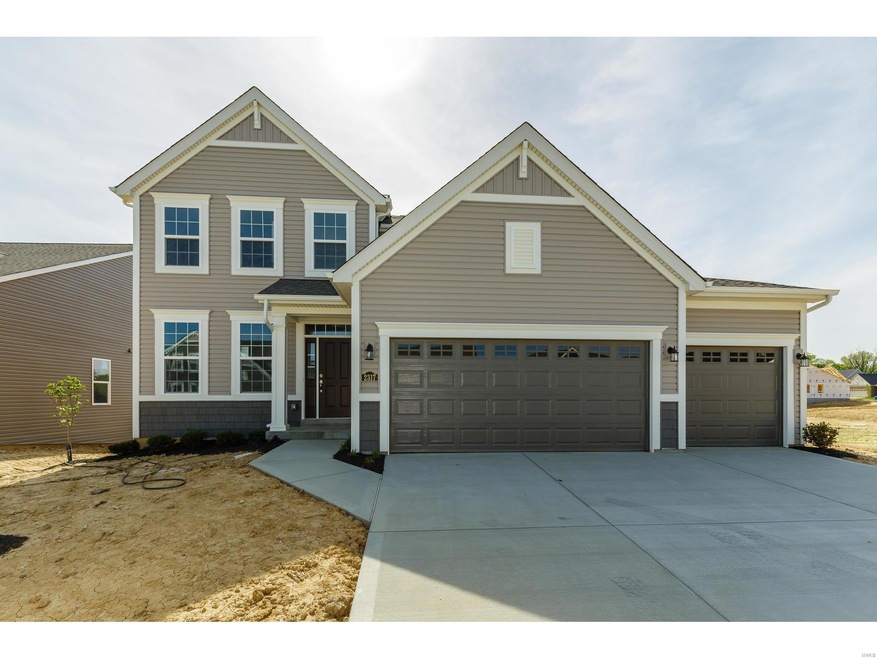 Front elevation showing 3 car garage