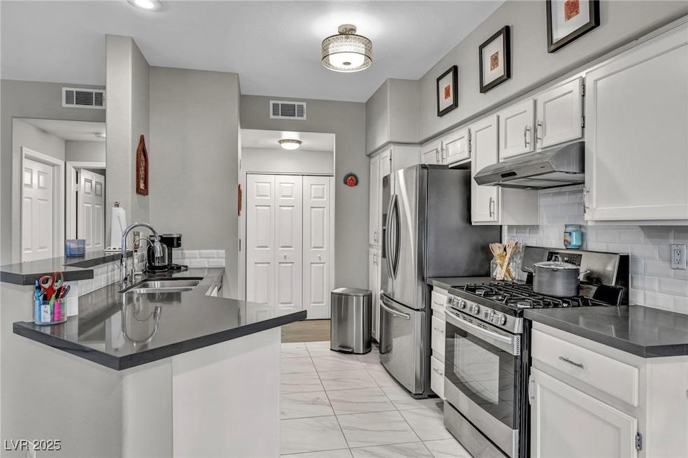 Kitchen with appliances with stainless steel finis