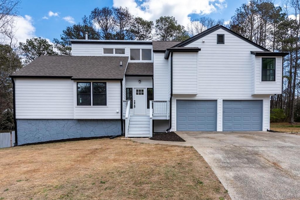 View of front of home featuring a shingled roof, a