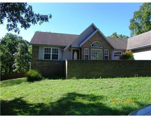 Exterior Front. Brick wall encloses front entry area