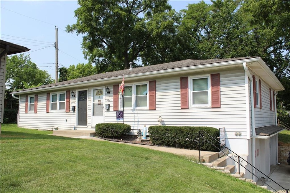 Ranch-style house with a front lawn