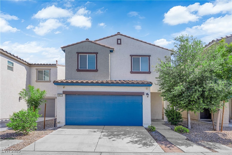 Mediterranean / spanish house featuring a tile roo