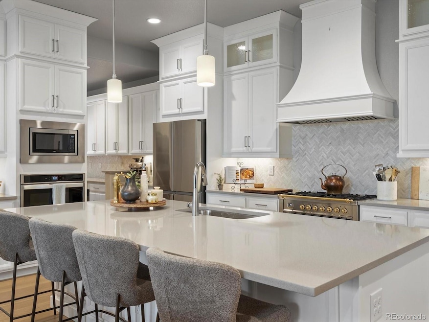 Notice the upper level cabinets and custom hood....both added by the seller after they purchased from the builder