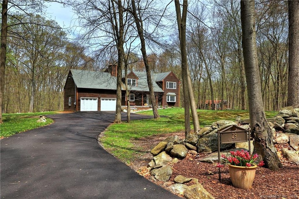 Privately set down a new asphalt driveway sits thi