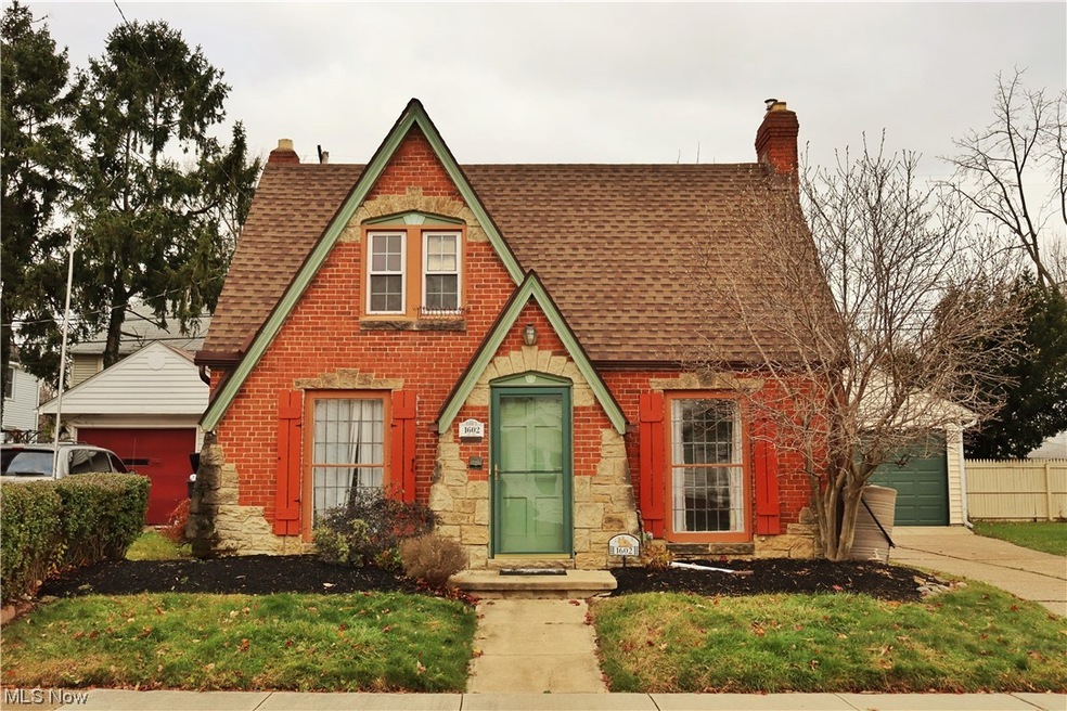 Cape cod home with detached garage