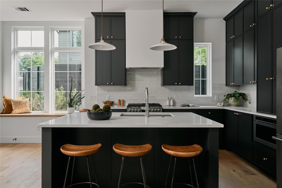 Kitchen featuring light wood-style flooring, deco