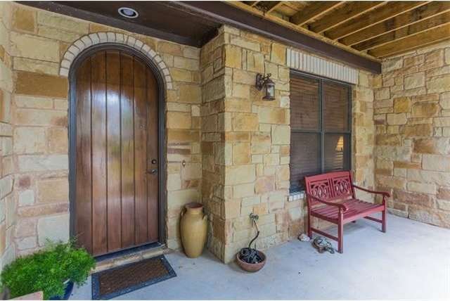Entrance to the condo with covered sitting area.