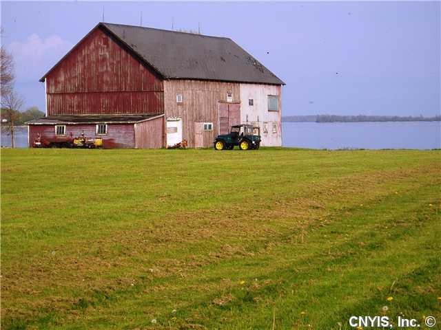 Exterior Front. Waterfront lot with large barn.