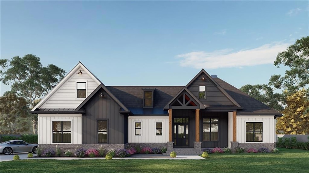 Modern inspired farmhouse with board and batten siding, a front lawn, and brick siding