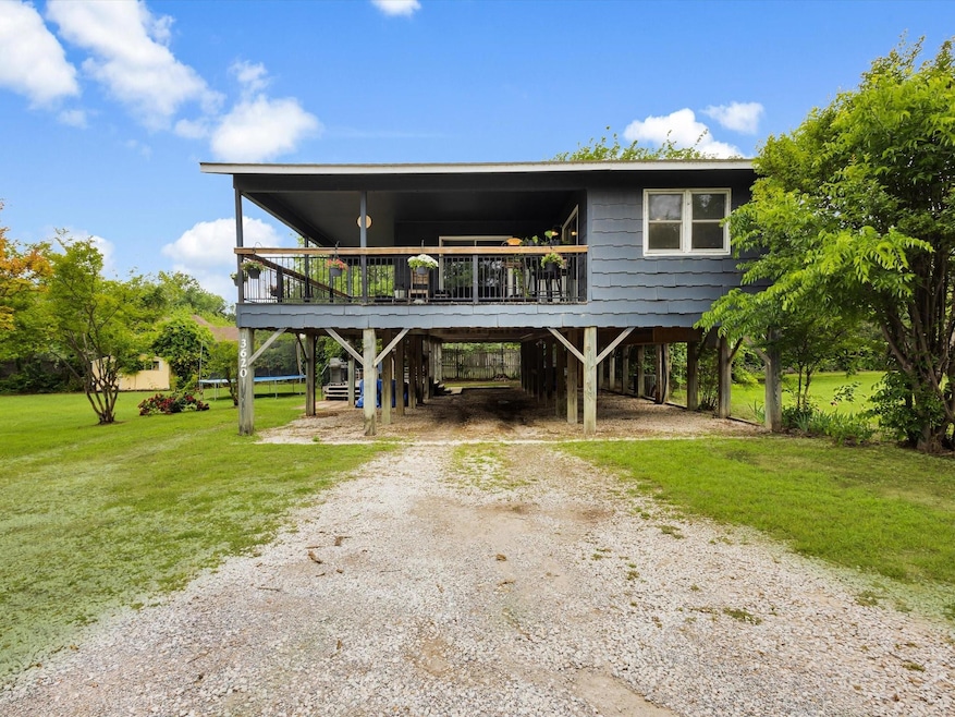Charming raised home with a spacious covered deck,