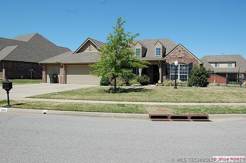 Front view of house with rod iron fence